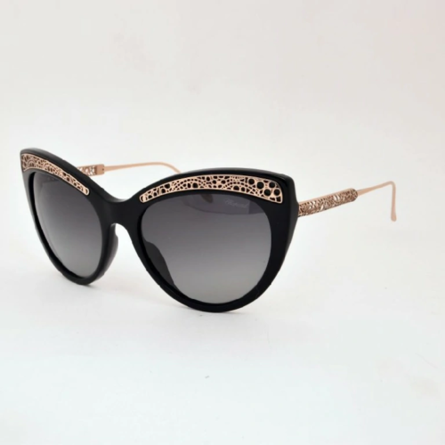 Lunette solaire noir et dore pour femme Chopard